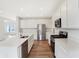 Kitchen showcasing a stainless steel refrigerator, white cabinets, and a large island at 19763 Atwater Ave, Sheridan, IN 46069