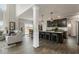 Modern kitchen with a large island with bar stools, stainless steel appliances, and hardwood floors at 19763 Atwater Ave, Sheridan, IN 46069