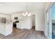 Bright kitchen features white cabinets, stainless steel appliances, and access to the backyard through sliding glass doors at 19763 Atwater Ave, Sheridan, IN 46069