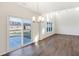 Spacious living room with ample natural light and access to the backyard through sliding glass doors at 19763 Atwater Ave, Sheridan, IN 46069