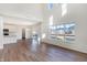 Bright living room featuring soaring ceilings, big windows with a view and wood-look flooring at 19763 Atwater Ave, Sheridan, IN 46069