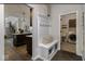 Convenient mudroom featuring a bench with storage and a laundry area, perfect for organization and functionality at 19763 Atwater Ave, Sheridan, IN 46069