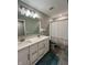 Bathroom features a double sink vanity, contemporary fixtures, and tiled floors for a modern style at 1986 Mccormick Dr, Greenwood, IN 46143