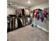 Large walk-in closet with ample hanging space and shelving, providing plenty of storage for clothes and accessories at 1986 Mccormick Dr, Greenwood, IN 46143