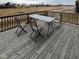 Outdoor deck features weathered wood and patio table with folding chairs, perfect for entertaining at 1986 Mccormick Dr, Greenwood, IN 46143