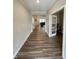 Spacious hallway featuring beautiful flooring and an open view to the living areas at 1986 Mccormick Dr, Greenwood, IN 46143