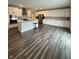 Modern kitchen with white cabinetry, a kitchen island, and stainless steel appliances at 1986 Mccormick Dr, Greenwood, IN 46143