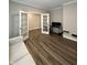 Study or office space with French doors, neutral walls, and dark wood-look flooring at 1986 Mccormick Dr, Greenwood, IN 46143