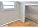 Attic nook featuring hardwood floors and white-painted walls at 210 S West St, Paragon, IN 46166