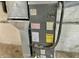 Close-up of a utility unit with visible EnergyGuide label and components in an unfinished basement setting at 210 S West St, Paragon, IN 46166