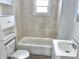 Bathroom features a tub and shower combination and updated vanity at 210 S West St, Paragon, IN 46166