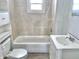 Cozy bathroom features a tub and shower combination and updated vanity at 210 S West St, Paragon, IN 46166