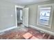 Bedroom with light walls, hardwood floors, and natural light from the window at 210 S West St, Paragon, IN 46166