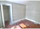 Corner bedroom with hardwood floors and a closet at 210 S West St, Paragon, IN 46166