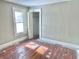 Bedroom with a large window, hardwood floors and a closet at 210 S West St, Paragon, IN 46166
