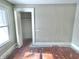 Sun-filled bedroom featuring a large window and closet with open door at 210 S West St, Paragon, IN 46166