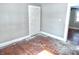 Bedroom with hardwood floors, white trim and paneled doors at 210 S West St, Paragon, IN 46166