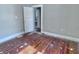 Bedroom with hardwood floors and paneled door at 210 S West St, Paragon, IN 46166