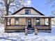 Classic home with covered porch, showcasing architectural charm and curb appeal at 210 S West St, Paragon, IN 46166