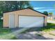 Detached garage with a single door and side entrance, offering convenient parking and storage space at 210 S West St, Paragon, IN 46166