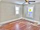 Hardwood floors in a gray-painted living room with natural light at 210 S West St, Paragon, IN 46166