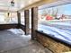 Spacious front porch with brick pillars, offering ample space to relax and enjoy the view at 210 S West St, Paragon, IN 46166