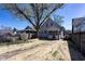 Large backyard with mature trees, offering shade and privacy at 2162 Ringgold Ave, Indianapolis, IN 46203