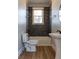 Modern bathroom featuring stylish tile work, updated fixtures, and a bright window at 2162 Ringgold Ave, Indianapolis, IN 46203