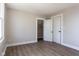 Neutral bedroom with walk-in closet and new flooring at 2162 Ringgold Ave, Indianapolis, IN 46203