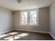 Sun-filled bedroom with two windows and light wood flooring at 2162 Ringgold Ave, Indianapolis, IN 46203