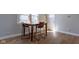 Bright dining area with wood flooring, modern furniture, and natural light from nearby windows at 2162 Ringgold Ave, Indianapolis, IN 46203