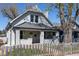 Charming white two-story home with a welcoming front porch and well-maintained yard at 2162 Ringgold Ave, Indianapolis, IN 46203