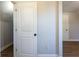 Hallway features fresh paint, modern base trim, and a door leading to attic storage at 2162 Ringgold Ave, Indianapolis, IN 46203