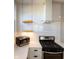 Modern kitchen featuring stainless steel appliances, stylish shelving, and white subway tile backsplash at 2162 Ringgold Ave, Indianapolis, IN 46203