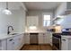 Well-equipped kitchen with white cabinetry, quartz countertops, and stainless steel appliances at 2162 Ringgold Ave, Indianapolis, IN 46203