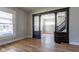 Spacious living area with dark decorative column entrance and large windows for natural light at 2162 Ringgold Ave, Indianapolis, IN 46203