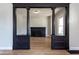 Elegant living room entrance with decorative columns and a striking dark fireplace at 2162 Ringgold Ave, Indianapolis, IN 46203