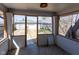 View of the screened-in porch looking out to the backyard and detached garage at 2162 Ringgold Ave, Indianapolis, IN 46203