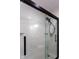 Modern subway tile shower with glass door and black trim at 2162 Ringgold Ave, Indianapolis, IN 46203