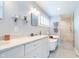 Bright bathroom featuring a marble countertop, soaking tub, and glass-enclosed shower at 219 Buckingham Dr, Indianapolis, IN 46208
