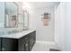 Elegant bathroom with marble countertop, double sinks, tiled floor and walk-in shower at 219 Buckingham Dr, Indianapolis, IN 46208