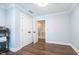 Bedroom with white door and trim, showing hardwood flooring at 219 Buckingham Dr, Indianapolis, IN 46208
