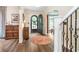 Welcoming foyer with wood floors and a view through the front door to the exterior at 219 Buckingham Dr, Indianapolis, IN 46208
