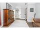 Hallway featuring hardwood floors, a cabinet, and neutral paint at 219 Buckingham Dr, Indianapolis, IN 46208