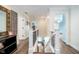 Bright hallway with wood floors and white trim, leading to multiple rooms at 219 Buckingham Dr, Indianapolis, IN 46208