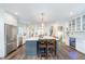 Bright and airy kitchen with a center island, stainless steel appliances, and ample cabinet space at 219 Buckingham Dr, Indianapolis, IN 46208