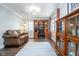 Cozy living room with built-in bookshelves and a comfortable leather sofa at 219 Buckingham Dr, Indianapolis, IN 46208