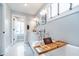 Elegant bathroom with a soaking tub, white cabinets, and modern fixtures at 219 Buckingham Dr, Indianapolis, IN 46208