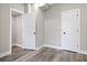 The bedroom shows new wood flooring, two doors, and modern trim work at 2257 E Brookside Ave, Indianapolis, IN 46218