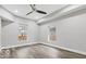 This bedroom features new paint, two windows, new wood floors, and recessed lighting at 2257 E Brookside Ave, Indianapolis, IN 46218